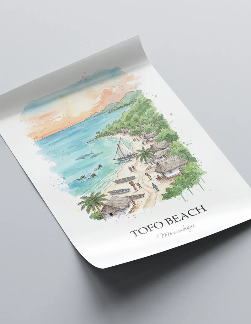 Framed wall art featuring Tofo Beach in Mozambique in a light wood frame leaning on the floor.