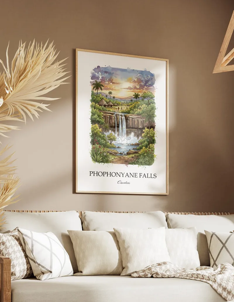 A gorgeous boho-inspired living space with a framed vintage travel poster of Phophonyane Falls in Eswatini on display.