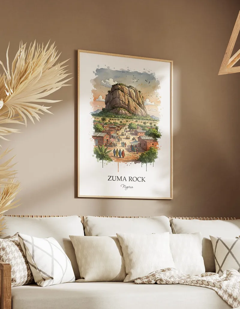 A gorgeous boho-inspired living space with a framed vintage travel poster of Zuma Rock in Nigeria on display.