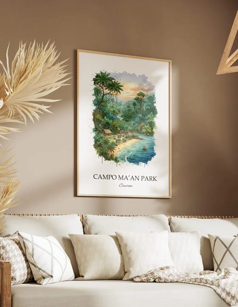 Cozy, well-lit workspace with a minimalist poster of Campo Ma'an Park, Cameroon in a light frame sitting on the desk.