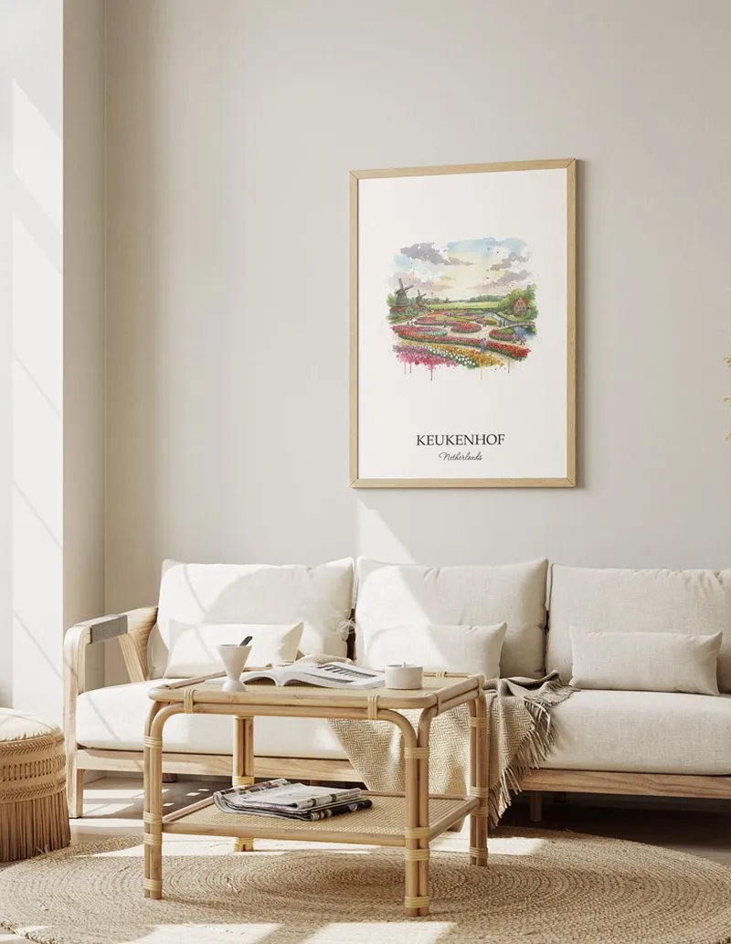 Framed wall art featuring Keukenhof, Netherlands in a light wood frame hanging above a sofa in a modern living room.