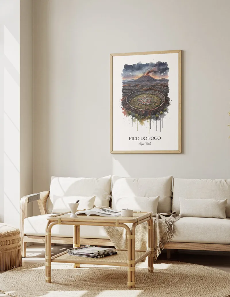 A gorgeous boho-inspired living space with a framed vintage travel poster of Pico do Fogo in Cape Verde on display.