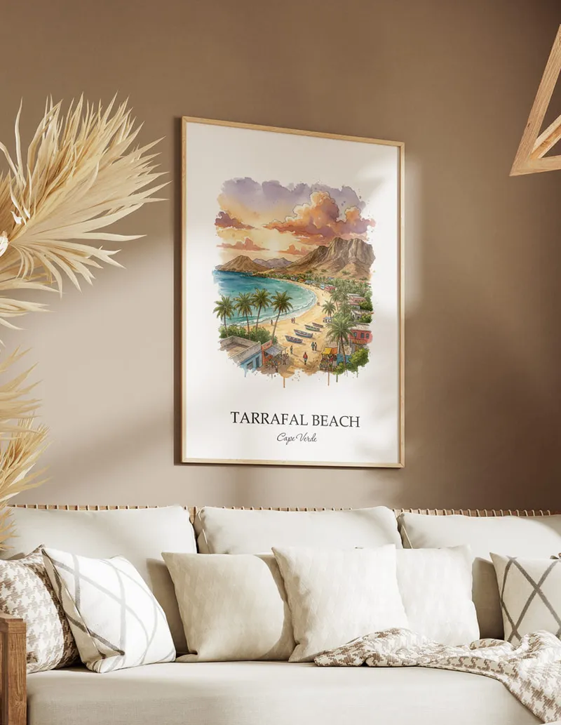 Cozy, well-lit workspace with a minimalist poster of Tarrafal Beach, Cape Verde in a light frame sitting on the desk.