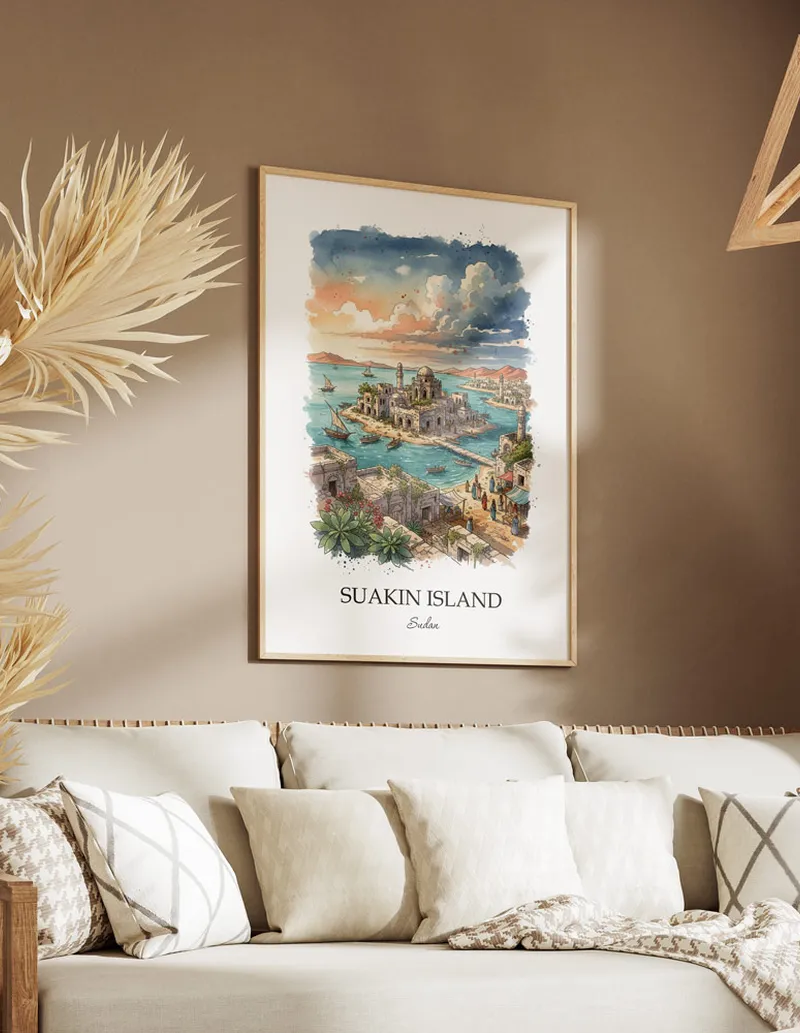 Cozy, well-lit workspace with a minimalist poster of Suakin Island, Sudan in a light frame sitting on the desk.