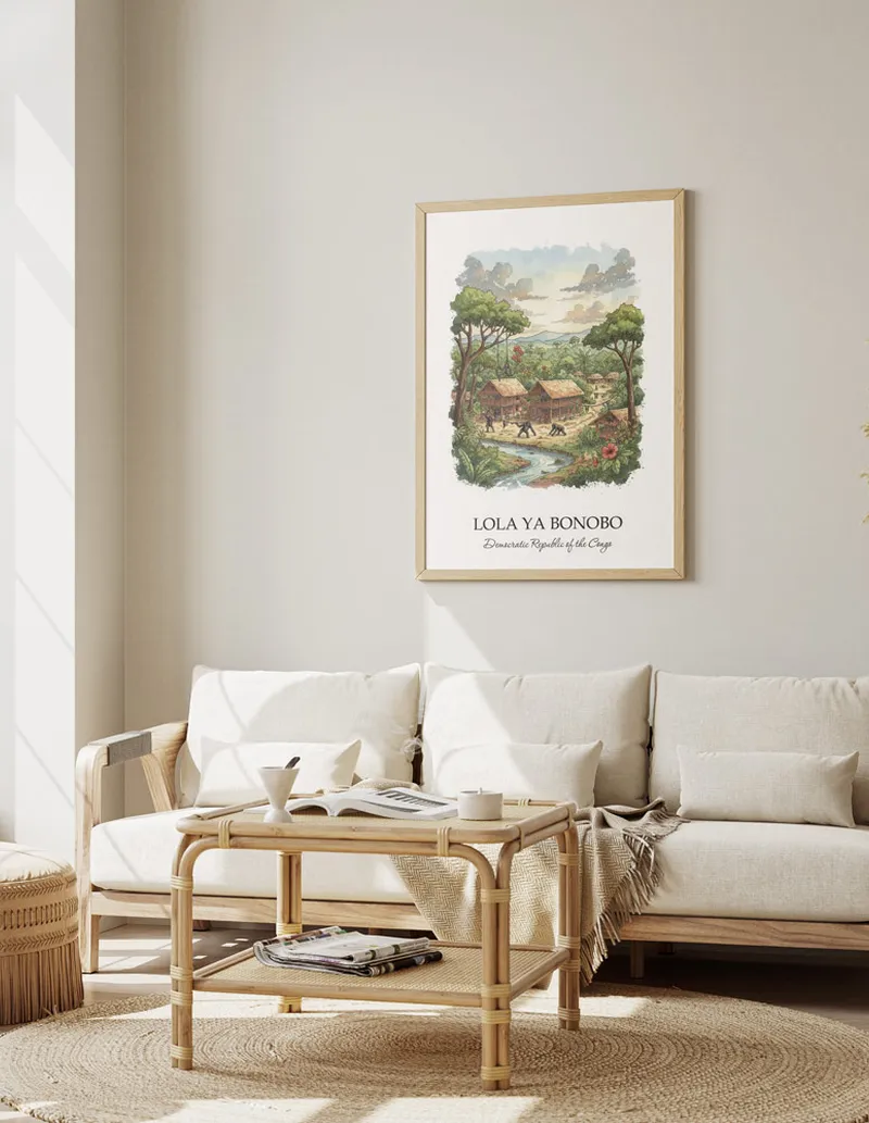 A gorgeous boho-inspired living space with a framed vintage travel poster of Lola ya Bonobo in DRC on display.