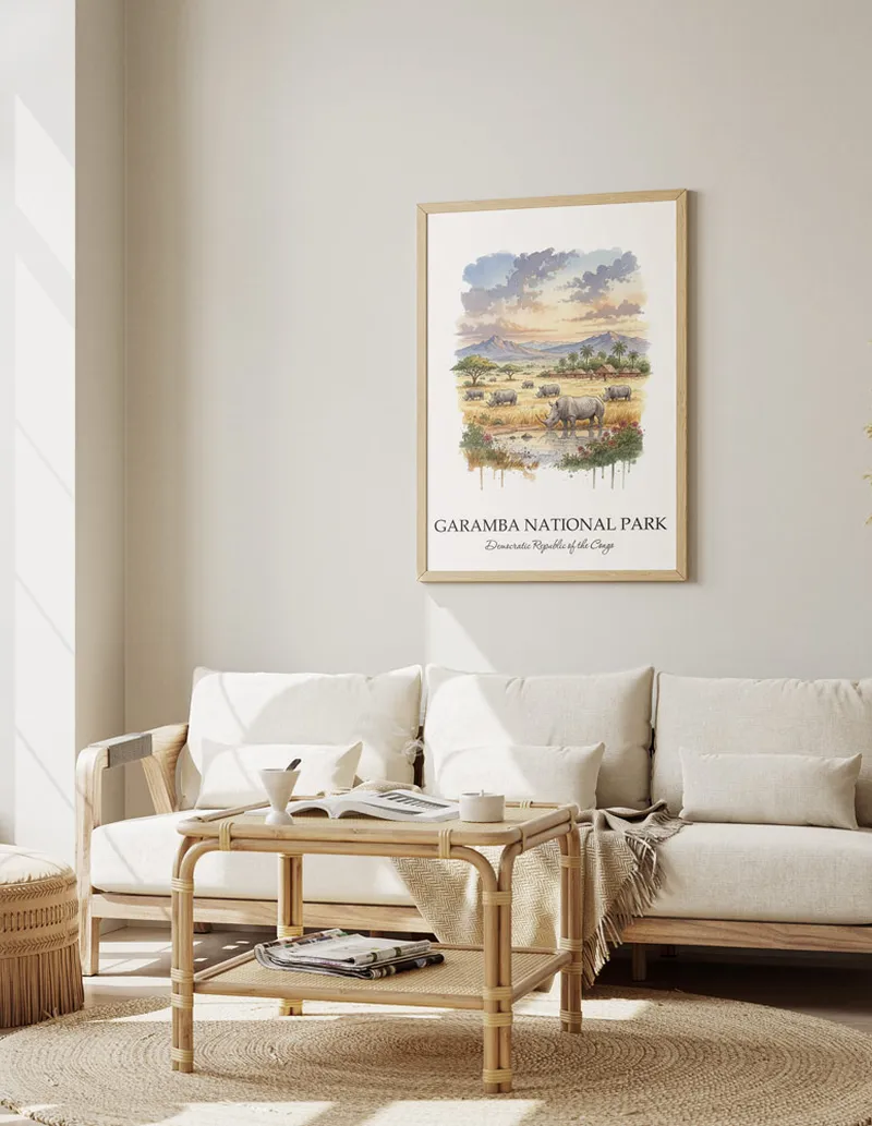 A gorgeous boho-inspired living space with a framed vintage travel poster of Garamba National Park in DRC on display.