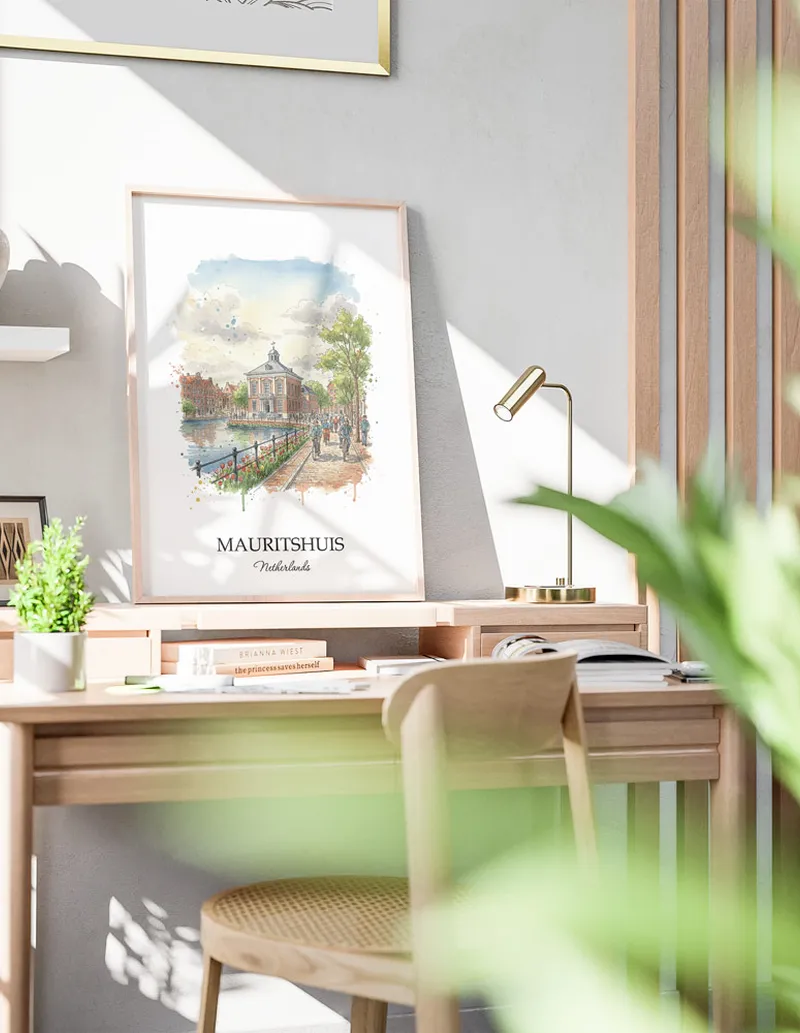 A gorgeous boho-inspired living space with a framed vintage travel poster of Mauritshuis in Netherlands on display.