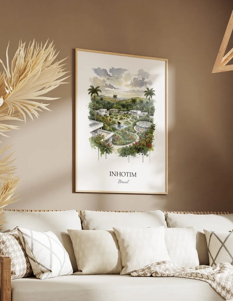 Cozy, well-lit workspace with a minimalist poster of Inhotim, Brazil in a light frame sitting on the desk.
