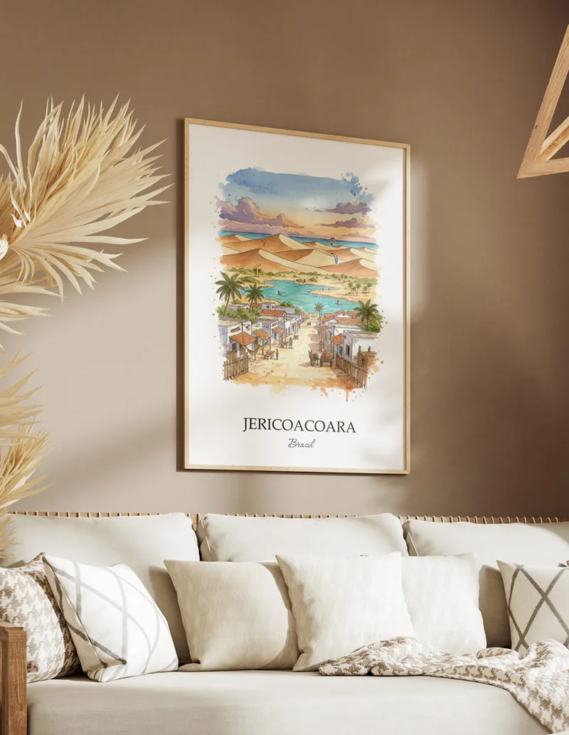 Cozy, well-lit workspace with a minimalist poster of Jericoacoara, Brazil in a light frame sitting on the desk.