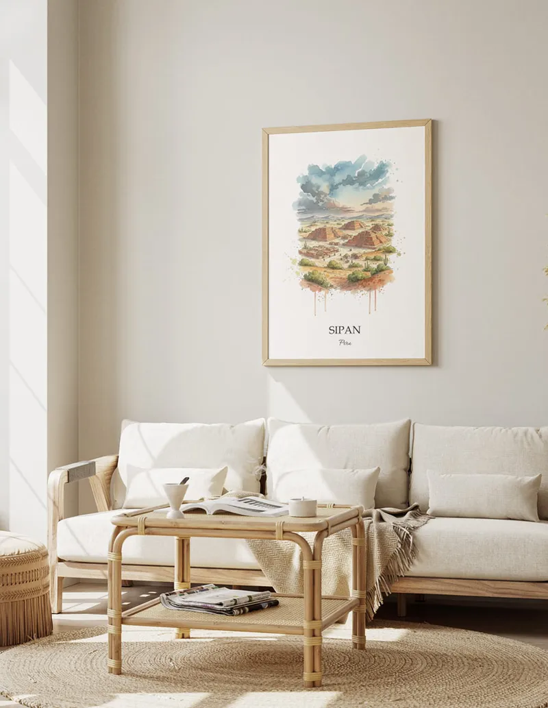 A gorgeous boho-inspired living space with a framed vintage travel poster of Sipan in Peru on display.