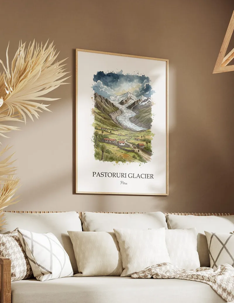 Cozy, well-lit workspace with a minimalist poster of Pastoruri Glacier, Peru in a light frame sitting on the desk.